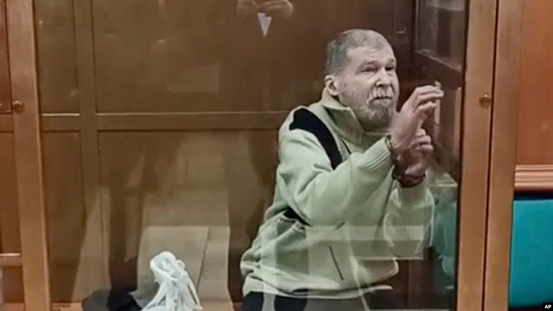 FILE - In this photo taken from video released by the Moscow City Court Press Service, Stephen Hubbard, a U.S. citizen accused of fighting as a mercenary in Ukraine, stands in a glass cage during a court session in the Moscow City Court on Oct. 7, 2024.