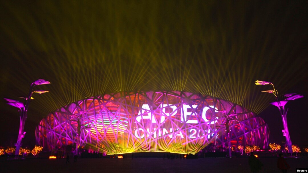 A screen displays the APEC logo on the National Stadium during a lights-and-fireworks rehearsal for the upcoming APEC Summit in Beijing, Nov. 4, 2014. 