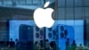 FILE - People check out the latest iPhone 13 handsets at an Apple Store in Beijing, China, Sept. 28, 2021. Amazon’s audiobook service Audible and phone apps for reading the Quran and Bible have become inaccessible for users in mainland China.
