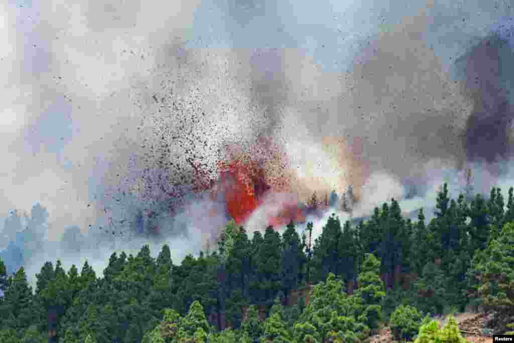 Lava and smoke rise following the eruption of a volcano in the Cumbre Vieja national park at El Paso, on the Canary Island of La Palma, Spain.