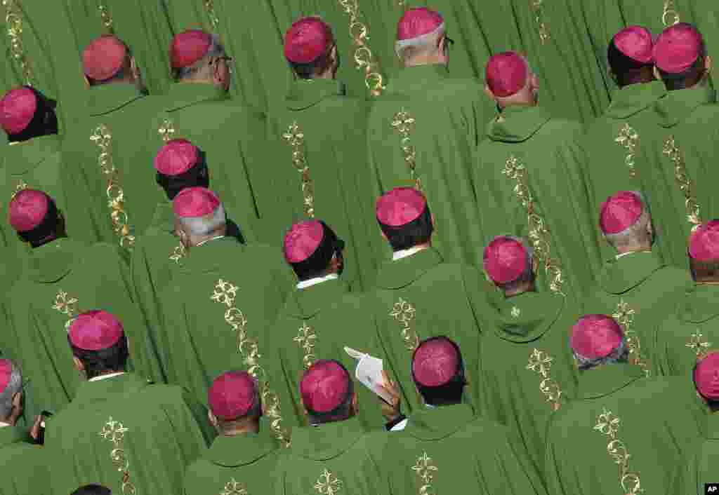 Bishops attend a Mass celebrated by Pope Francis for the opening of a synod in St. Peter's Square at the Vatican.