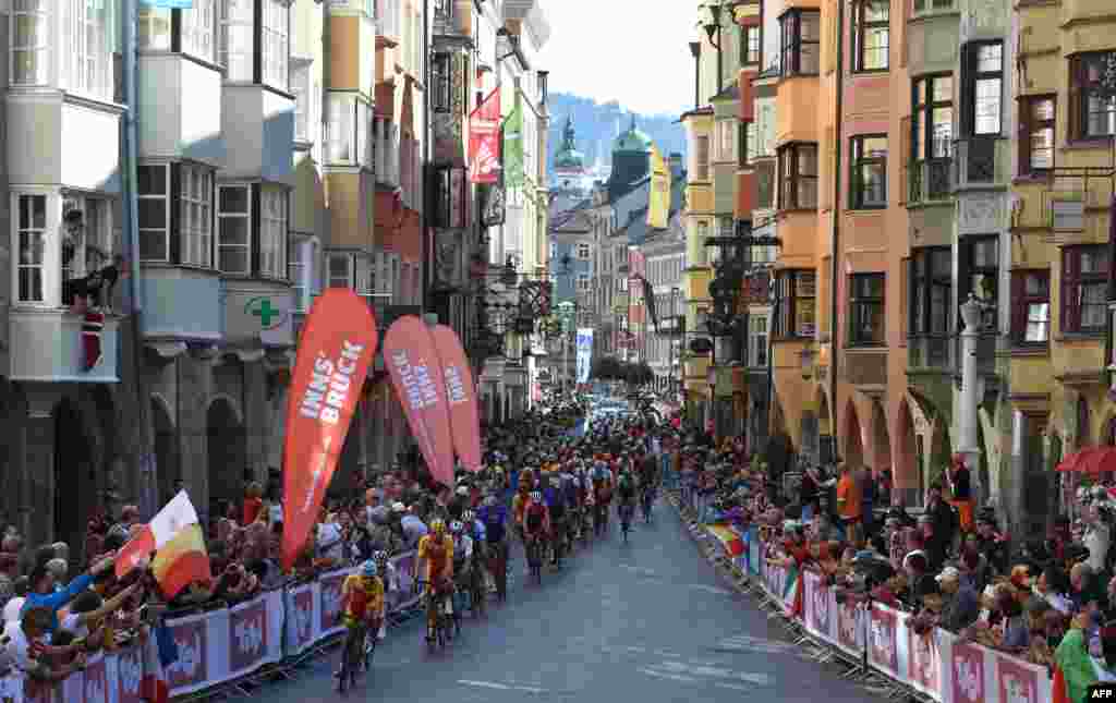 Participants drive through the old city of Innsbruck, Austria, during the Men's Elite road race of the 2018 UCI Road World Championships. 