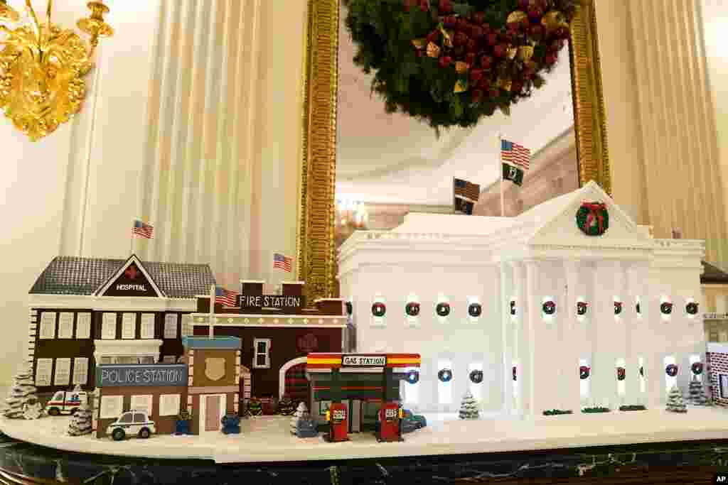 Gingerbread houses sit in the East Room of the White House during a press preview of the White House holiday decorations, Nov. 29, 2021.