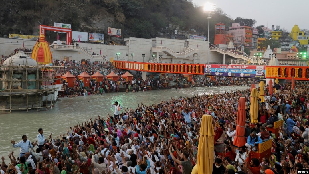 Devotees gather on the banks of Ganges river to pray ahead of the first Shahi Snan at "Kumbh Mela" or the Pitcher Festival, in Haridwar, India, March 10, 2021.