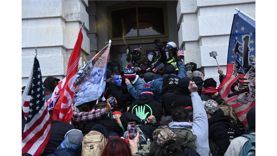 FILE - Trump supporters clash with police and security forces as they storm the U.S. Capitol in Washington, Jan. 6, 2021.