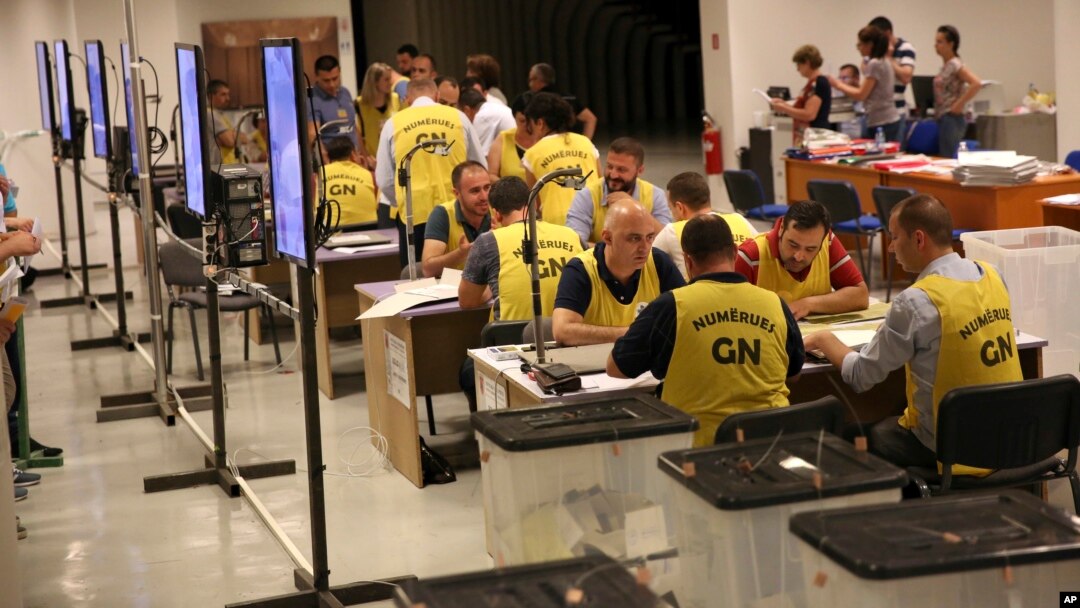 Election staff count ballots in Tirana, Albania, June 26, 2017.