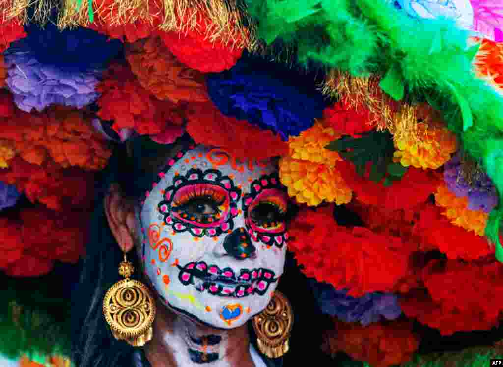 A woman with her face painted as a Catrina attends the skull day celebrations ahead of the day of the dead in Monterrey, Nuevo Leon State, Mexico, Oct. 27, 2024.