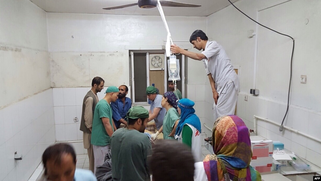 In this photograph released by Medecins Sans Frontieres (MSF) on October 3, 2015, Afghan MSF surgeons work in an undamaged part of the MSF hospital in Kunduz after the operating theaters were destroyed in an airstrike. 