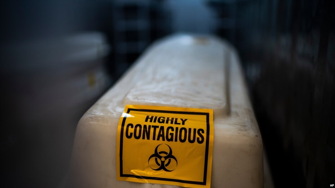 A sealed coffin containing the remains of a COVID-19 victim is stored in a refrigerated container in Johannesburg, South Africa, Feb. 2, 2021. 