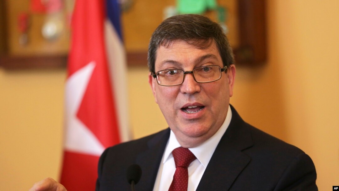 Cuba Foreign Minister Bruno Rodrigues Parrilla gestures during a news conference following his meeting with his Portuguese counterpart Augusto Santos Silva at Lisbon's Necessidades palace Wednesday, April 19, 2017. 