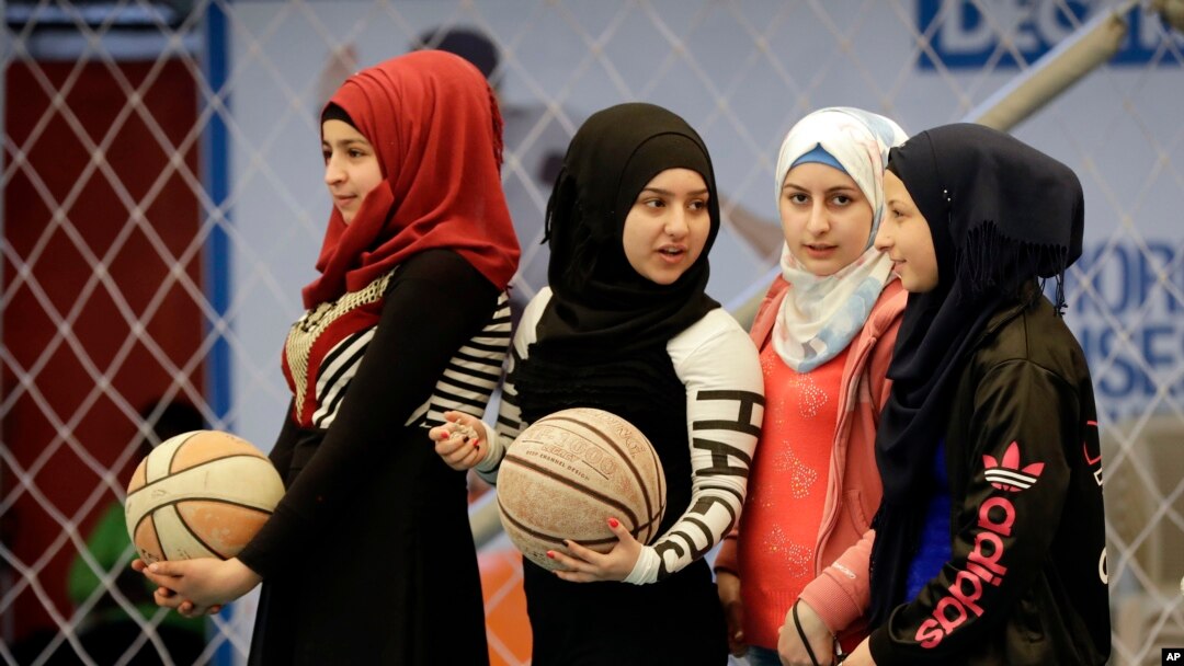 Syrian refugee girls attend a basketball training session at a private sports club, southern Beirut, Lebanon, Feb. 19, 2017.