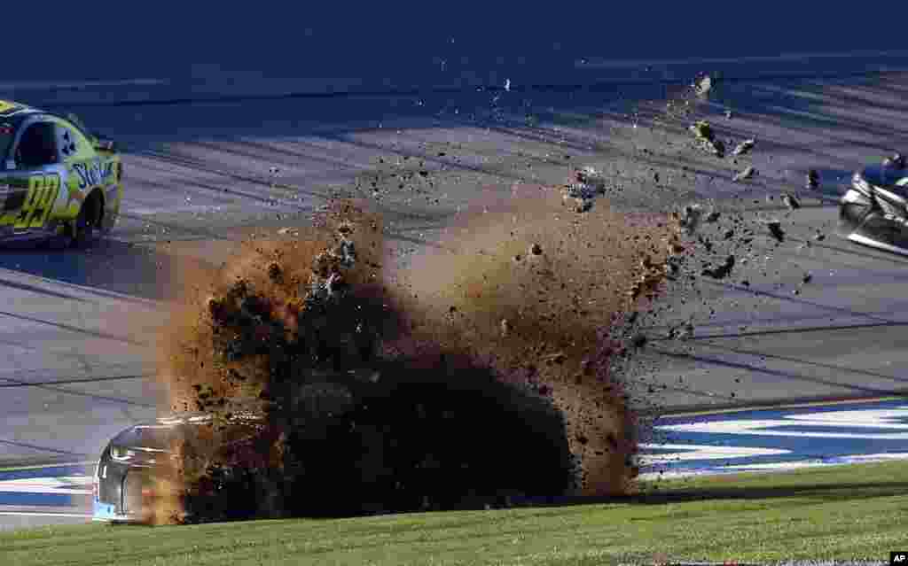 Jamie McMurray (1) slides through the infield during the 1000Bulbs.com 500 NASCAR Cup Series auto race at Talladega Superspeedway in Talladega, Atlanta, Georgia.