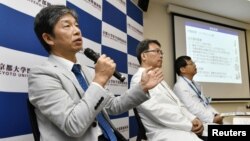 Jun Takahashi, left, professor at Kyoto University's Centre for iPS Cell Research and Application, attends a news conference in Kyoto, Japan, July 30, 2018. 