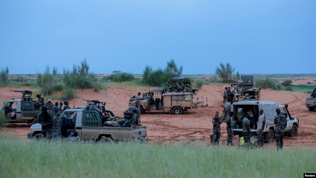 FILE - Malian soldiers are seen during a patrol in Dansongo Circle, Mali, Aug. 23, 2021. Twenty-seven Malian soldiers were killed and 33 wounded during an attack on a central Mali military camp in the town of Mondoro Friday.
