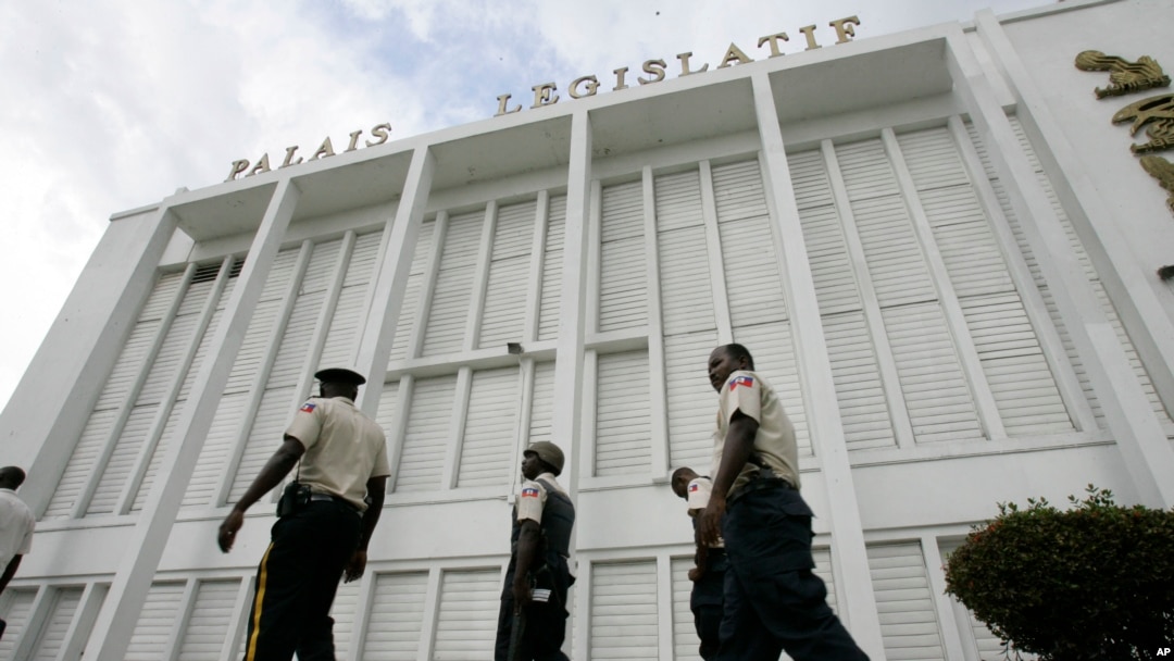 Guards patrol front of Haiti's parliament - Palais Legislatif - in Port-au-Prince. 