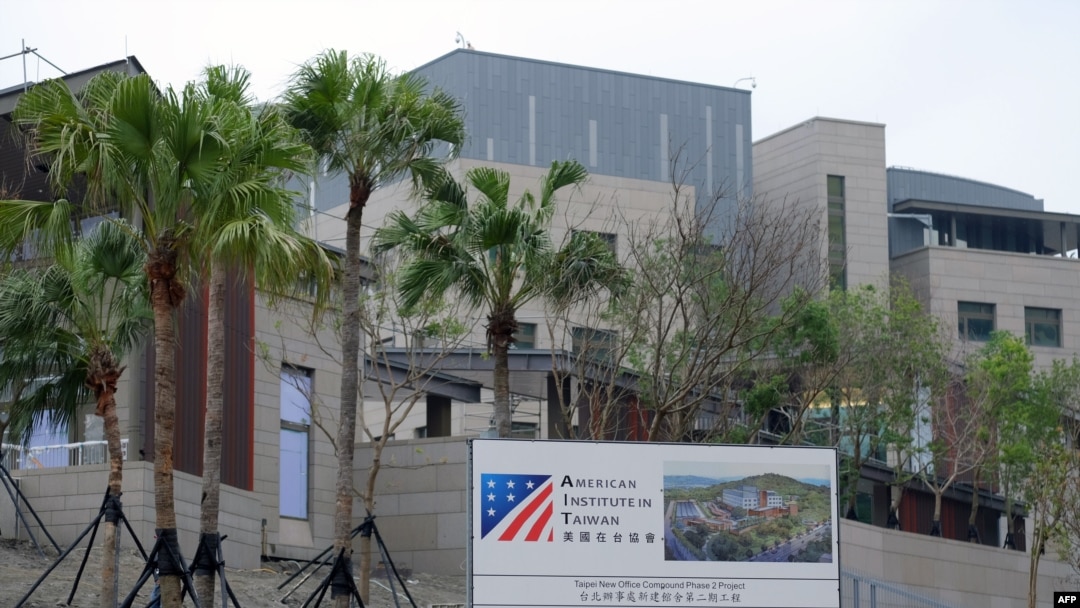 FILE - bIn this photograph taken on May 3, 2018, construction signage is seen in front of the newly-built American Institute in Taipei (AIT) building in Taipei. 