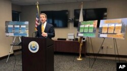 California Insurance Commissioner Dave Jones talks about the costs of recent wildfires during a news conference in Sacramento, California.