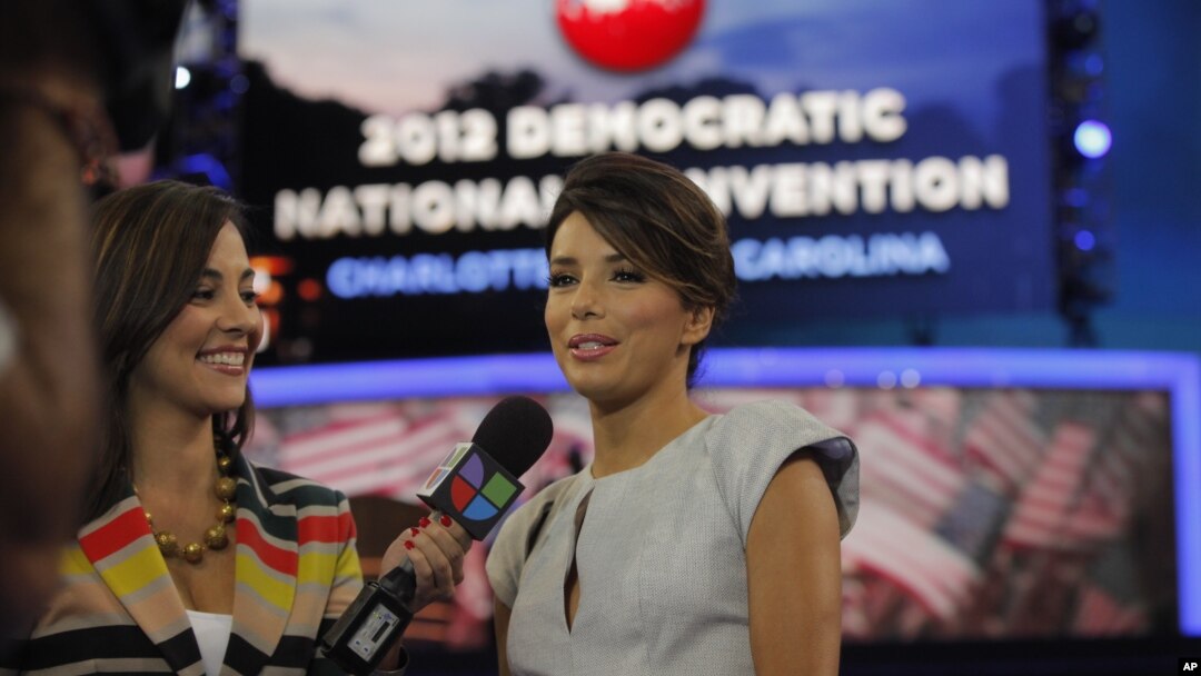 Actress Eva Longoria, right, is interviewed by Mariana Atencio of Univision on the floor of the Democratic National Convention in Charlotte, N.C., Sept. 6, 2012. 