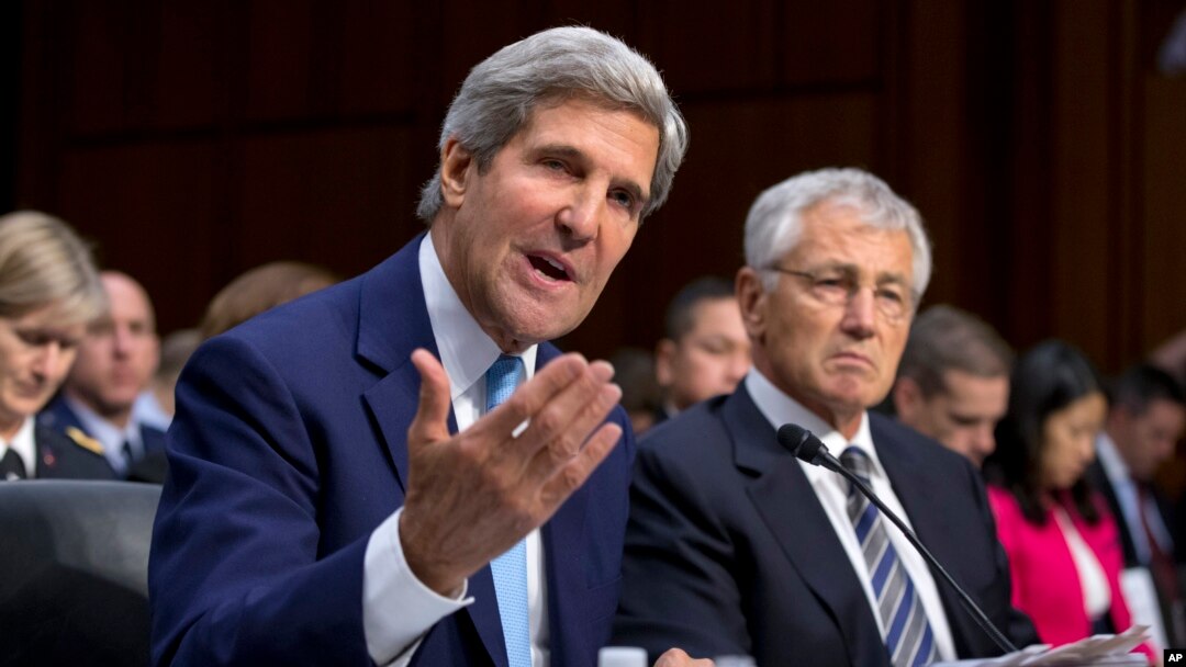 Secretary of State John Kerry, left, and Defense Secretary Chuck Hagel, right, appear before the Senate Foreign Relations Committee, Sept. 3, 2013, on Capitol Hill in Washington. 