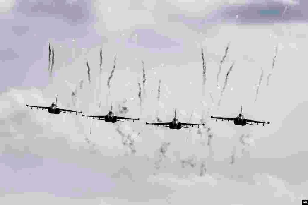 Belarusian military jets fly during military exercises, near the Volka village, 200 kilometers (125 miles) southwest of Minsk.