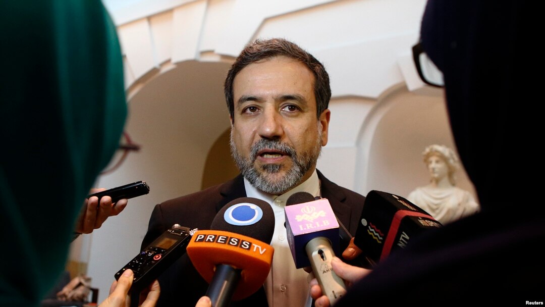 FILE - Iran's top nuclear negotiator Abbas Araqchi talks to journalists after meeting senior officials from the United States, Russia, China, Britain, Germany and France in Vienna, Austria, Oct. 19, 2015. 