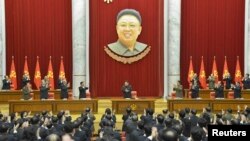 North Korean leader Kim Jong Un (C) supervises a meeting of the Central Committee of the Workers' Party of Korea, under a portrait of his father, Kim Jong Il, in Pyongyang. The photo was released on February 18, 2015 by North Korea's Korean Central News Agency (KCNA photo via REUTERS)
