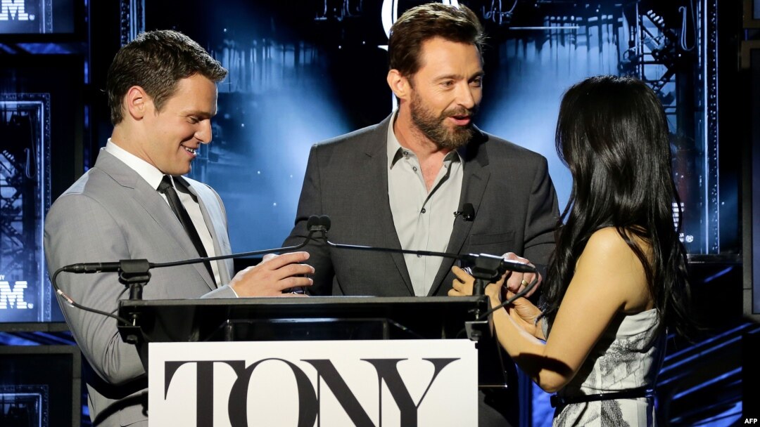 NEW YORK, NY (L-R) Actors Jonathan Groff, Hugh Jackman and Lucy Liu speak onstage at the 2014 Tony Awards Nominations Ceremony at the Diamond Horseshoe at the Paramount Hotel, April 29, 2014 in New York City.
