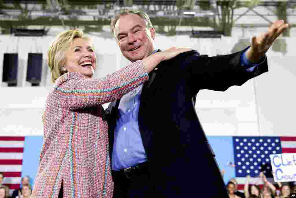 In this July 14, 2016, file photo, Democratic presidential candidate Hillary Clinton, accompanied by Sen. Tim Kaine, D-Va., speaks at a rally at Northern Virginia Community College in Annandale, Va. Clinton chose Kaine to be her running mate. (AP Photo/An