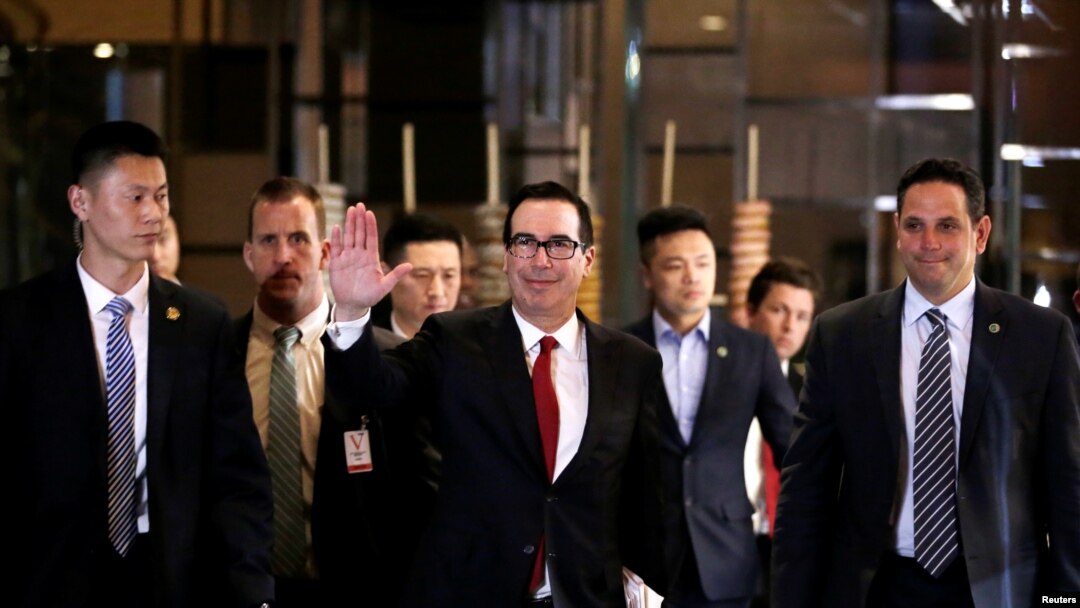 U.S. Treasury Secretary Steven Mnuchin, a member of the U.S. trade delegation to China, waves to the media as he returns to a hotel in Beijing, China, May 3, 2018.