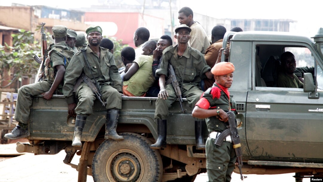 Congolese soldiers are seen on a pick-up truck after dispersing civilians protesting against what they say is the government's failure to stop killings and inter-ethnic tensions in the town of Butembo, North Kivu province, DRC, Aug. 24, 2016.