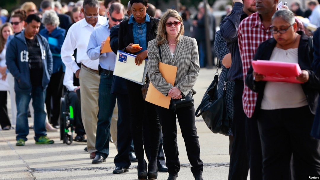 FILE - People wait in line to enter the Nassau County Mega Job Fair at Nassau Veterans Memorial Coliseum in Uniondale, N.Y., Oct. 7, 2014. 
