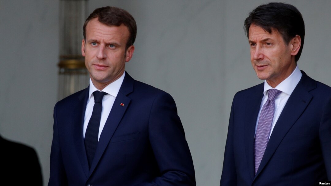 French President Emmanuel Macron accompanies Italian Prime Minister Giuseppe Conte after a meeting at the Elysee Palace in Paris, France, June 15, 2018. 