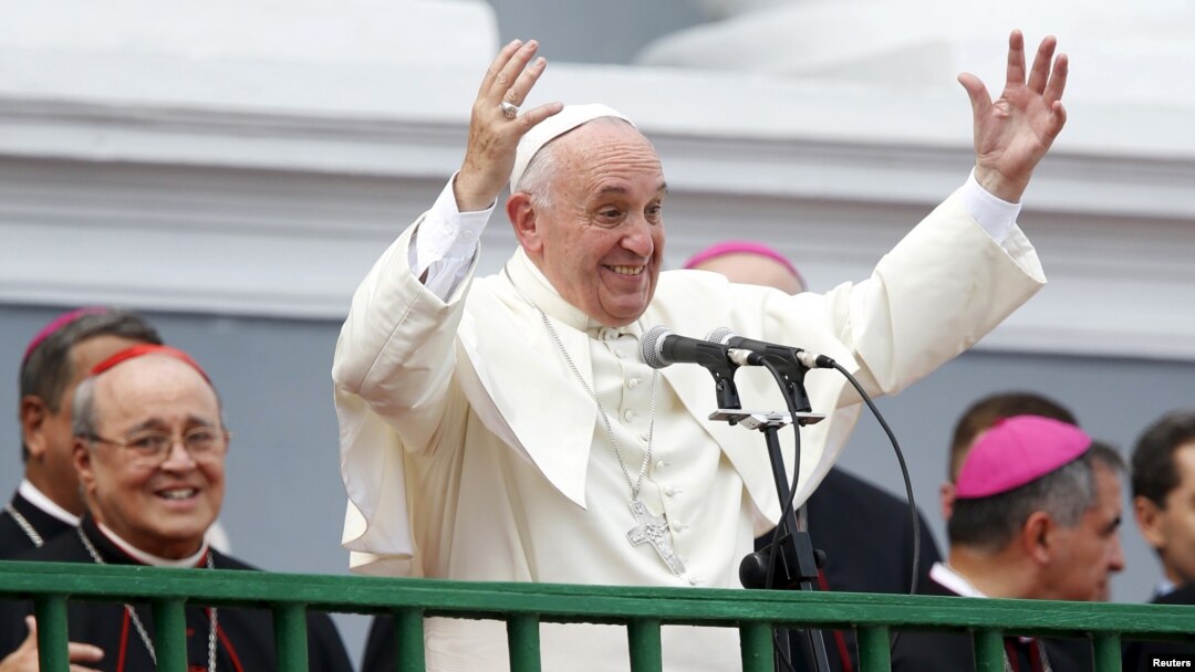 Pope Francis gestures while addressing the crowd from the Cathedral of Our Lady of the Assumption in Santiago, Cuba, Sept. 22, 2015. 