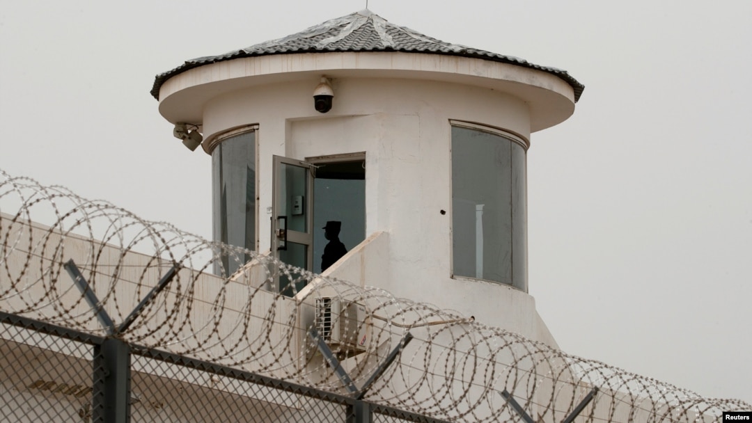 FILE - A guard stands in a watchtower in Kashgar, Xinjiang Uyghur Autonomous Region, China, May 3, 2021. 