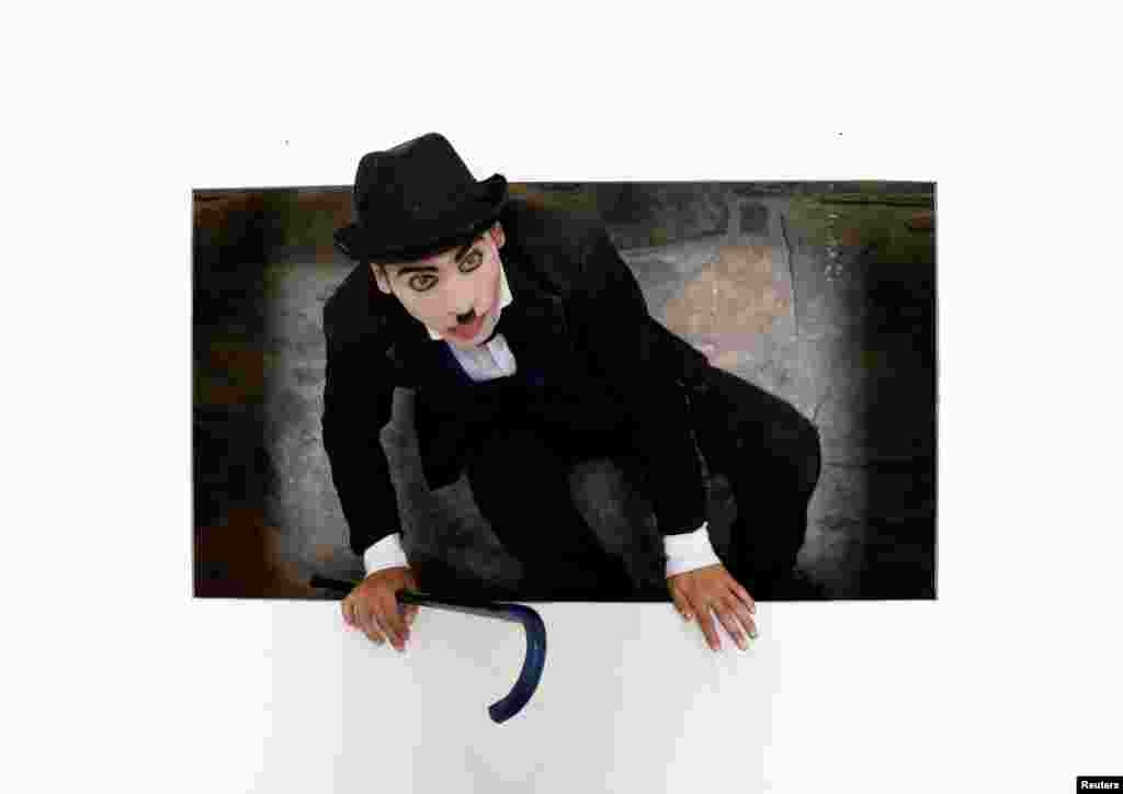 Karim Asir, 25, Afghanistan's Charlie Chaplin, exercises during his rehearsals in Kabul.