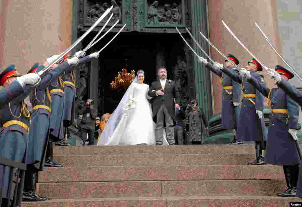 Grand Duke George Mikhailovich Romanov and Victoria Romanovna Bettarini leave St. Isaac's Cathedral after their wedding ceremony in Saint Petersburg, Russia.