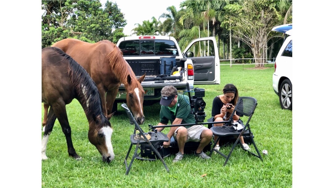 Videographer John Oliva, owner of Digital Cut Productions in Fort Lauderdale, volunteers his company's services to help others during the COVID-19 epidemic. Here, they shoot a video on a horse farm for a fellow small-business owner.