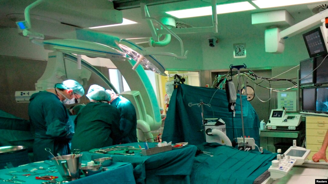 FILE - An undated picture show surgeons during a pacemaker implantation at the German Heart Institute Berlin (DHZB) in Berlin, Germany.