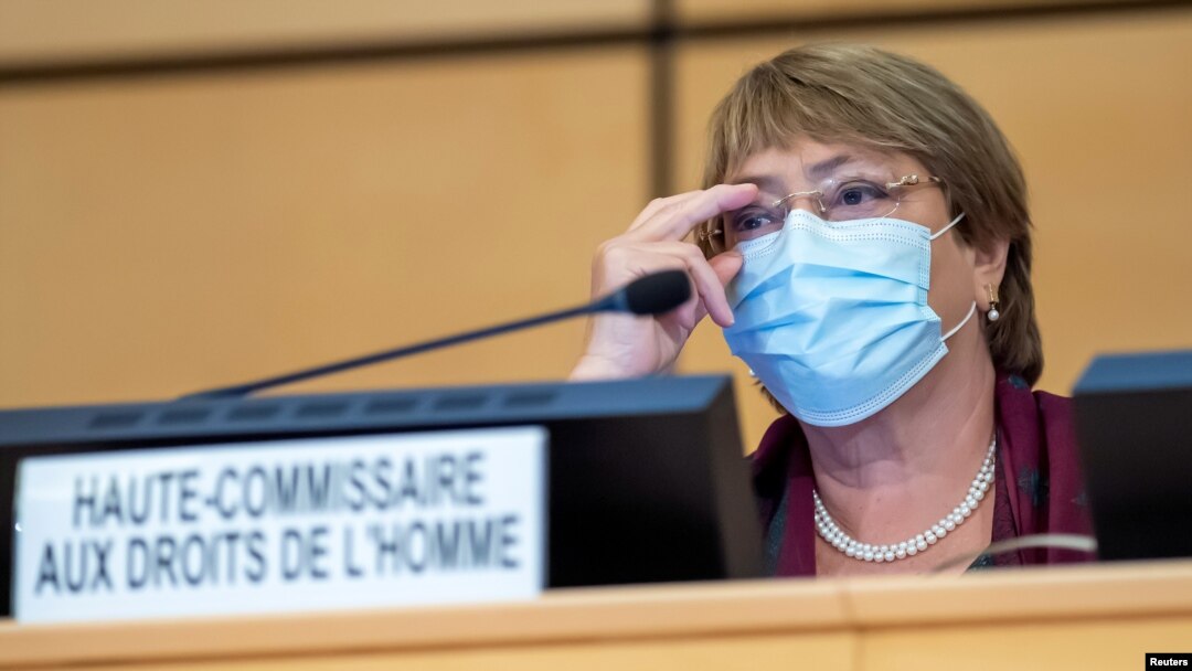 FILE - United Nations' High Commissioner for Human Rights Michelle Bachelet adjusts her glasses during the opening of 45th session of the Human Rights Council, at the European UN headquarters in Geneva, Sept. 14, 2020. 