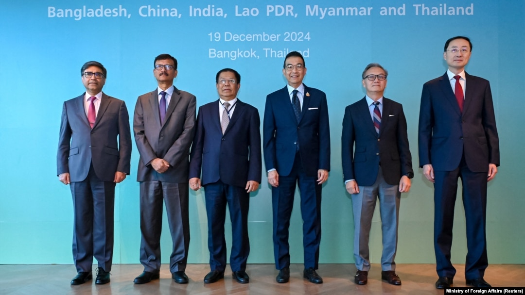 Officials from India, Bangladesh, Myanmar, Thailand, Laos and China pose for a photo before the six-country informal consultation to discuss ways to address shared concerns, in Bangkok, Thailand, Dec. 19, 2024.